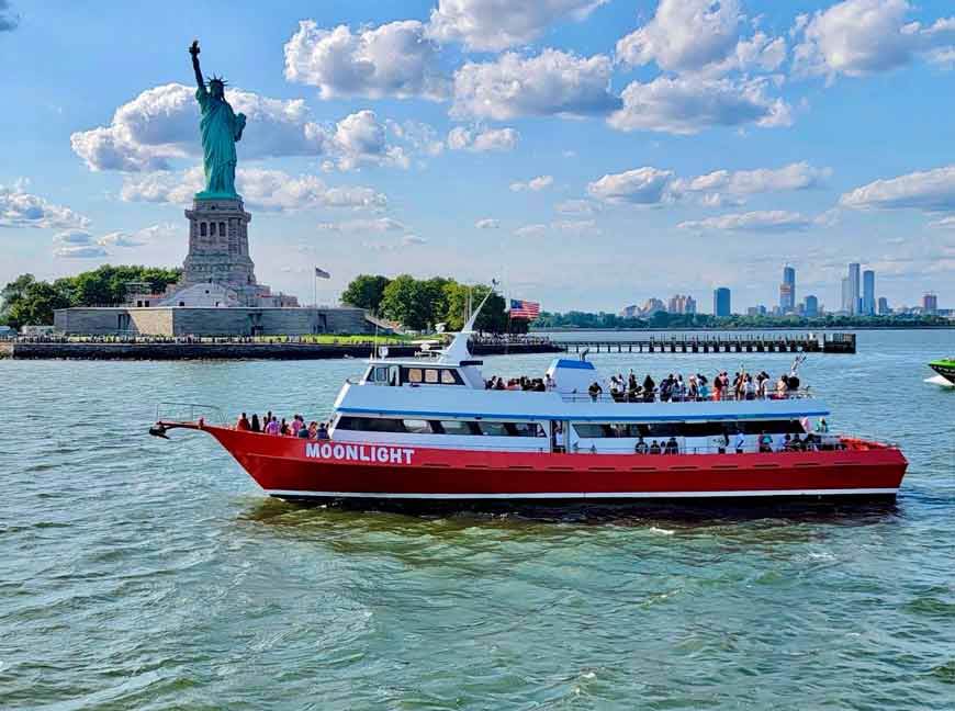 Guests enjoying a daytime Manhattan Scenic Cruises experience in New York Harbor.